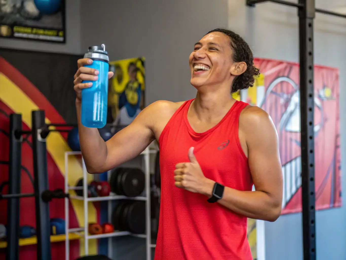 A motivational image depicting a Fitando client celebrating a fitness milestone, such as achieving a personal best in weightlifting or completing a challenging workout. The client is visibly happy and empowered, symbolizing the transformative impact of Fitando's training programs on their overall well-being and confidence.